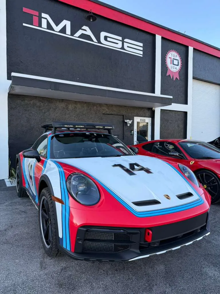 Porsche 911 Dakar in Martini livery outside the IMAGE Premium Detailing shop